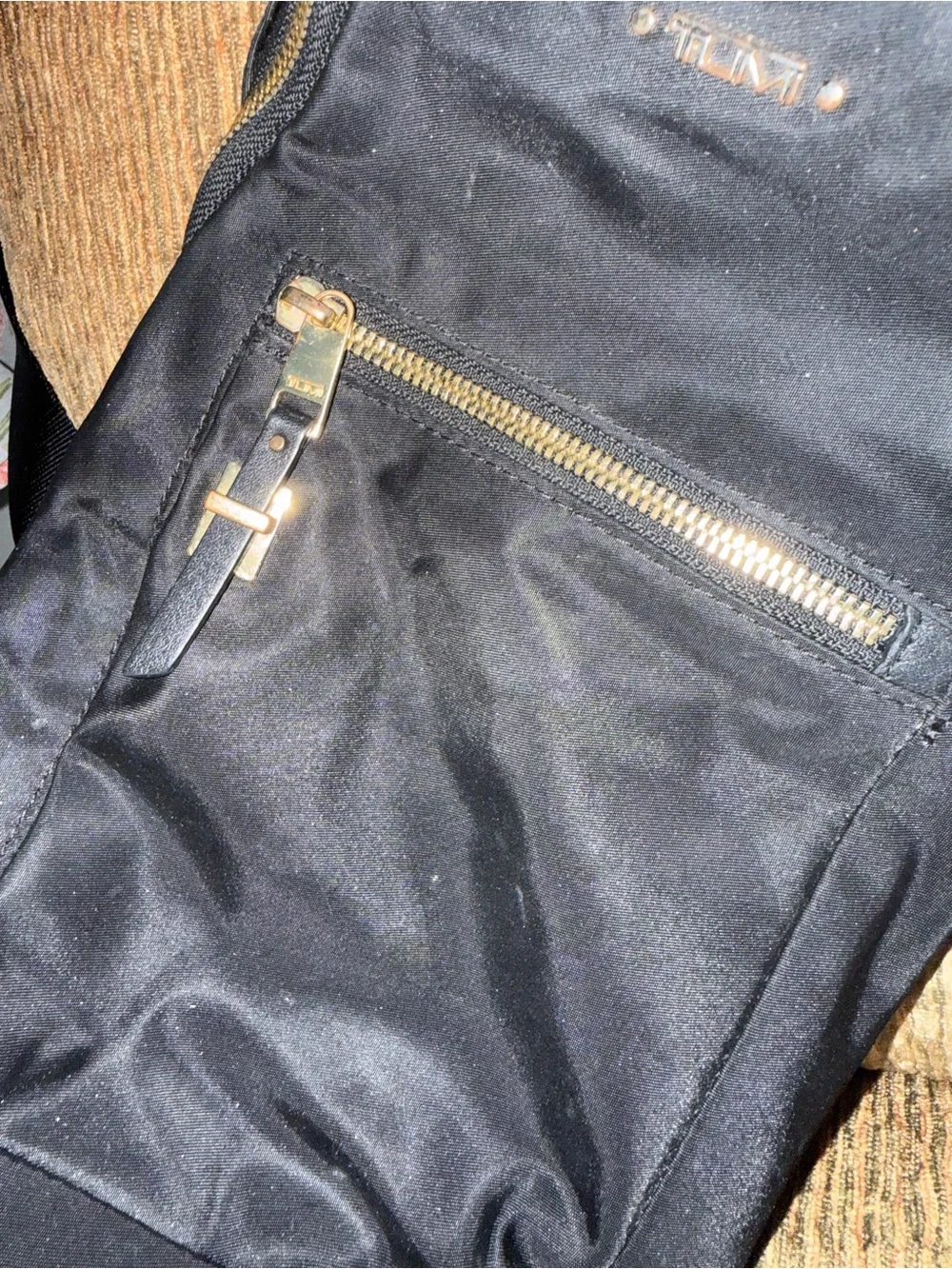 Tumi Black Sling Belt Bag with Gold Hardware
